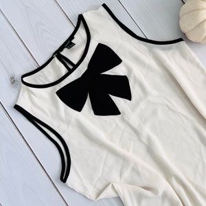 Ivory Sleeveless Blouse With Black Bow